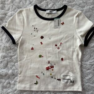 NWT Twik Simons Women’s Tee Shirt with Graphic Print and Gems in Small/Medium